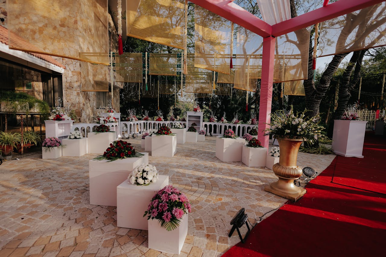 Beautifully decorated outdoor wedding venue with floral arrangements and canopy.